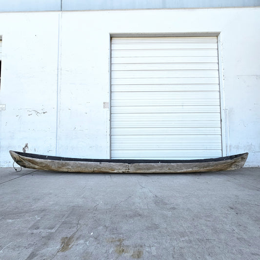 Early Wooden Canoe on Stands