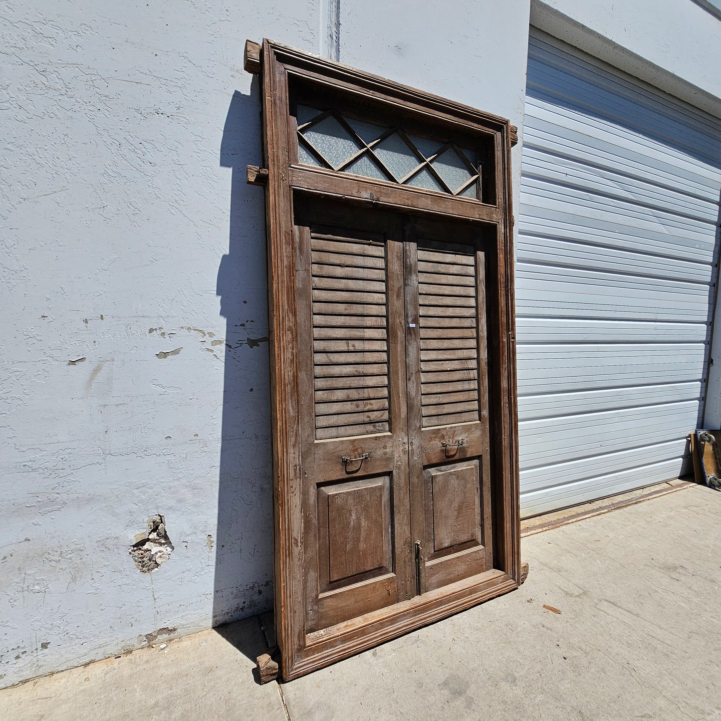 Pair of Wood Shuttered Doors with Glass Transom in Frame