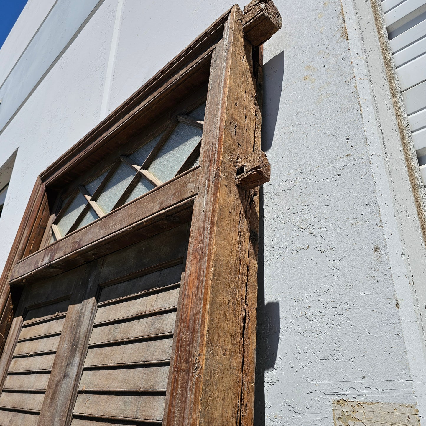 Pair of Wood Shuttered Doors with Glass Transom in Frame