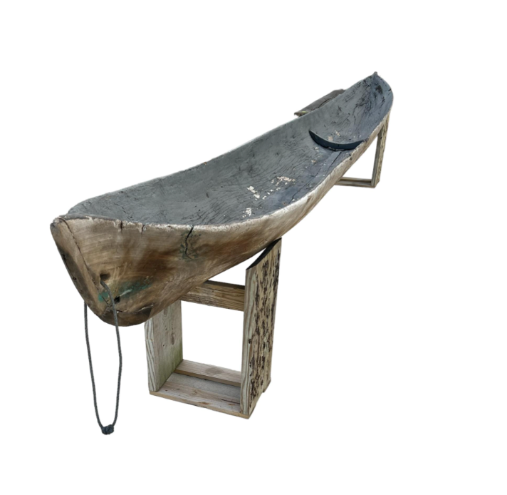 Early Wooden Canoe on Stands
