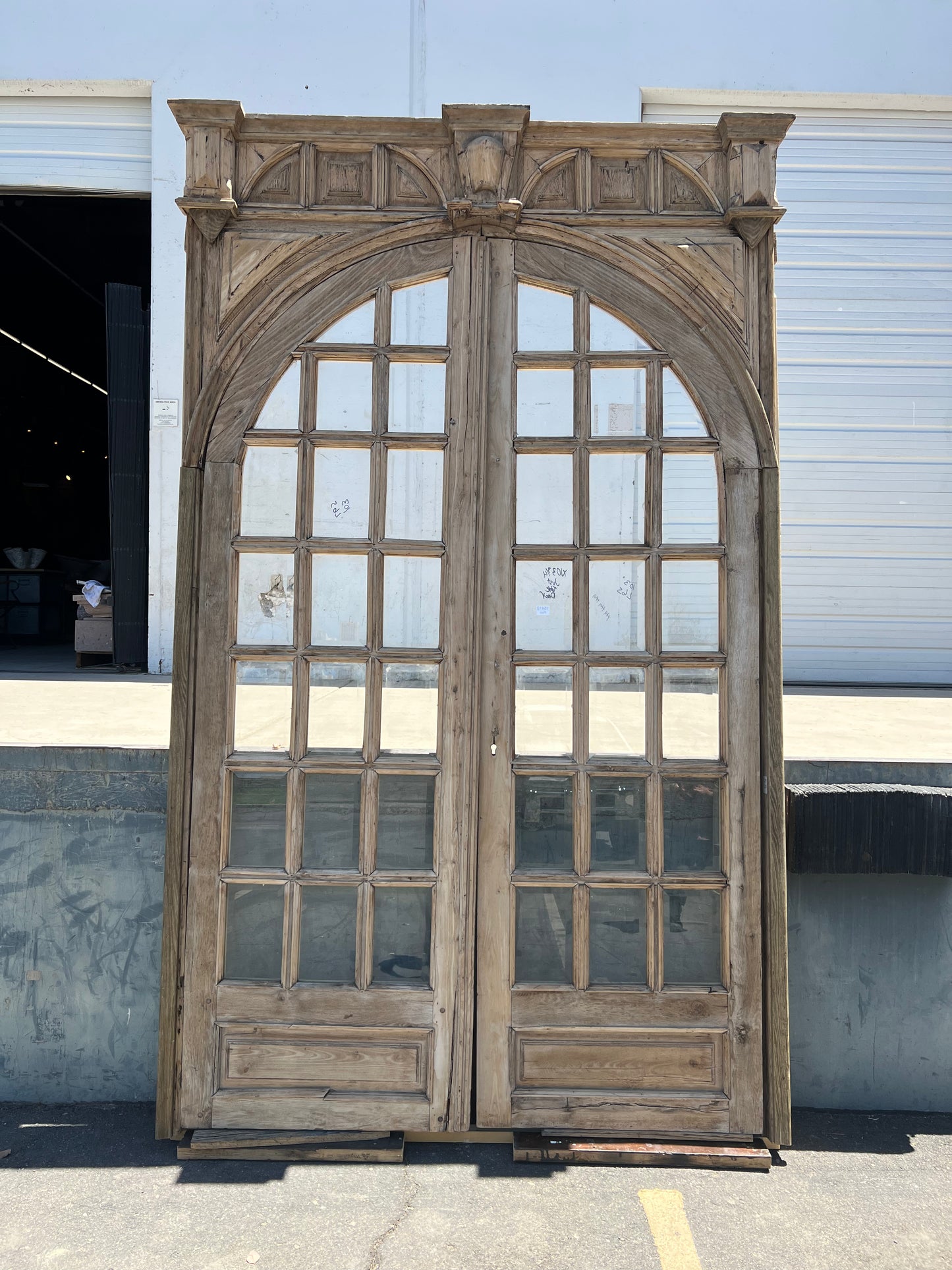 Pair of Arched Carved Wood Doors