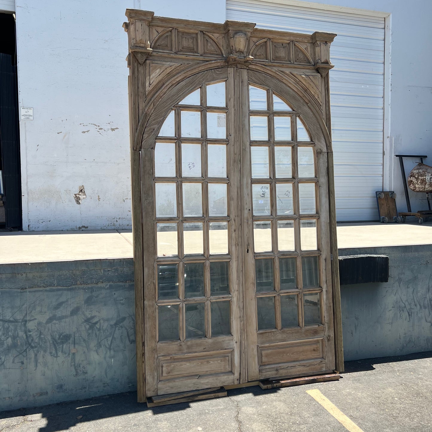 Pair of Arched Carved Wood Doors