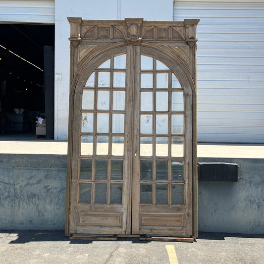 Pair of Arched Carved Wood Doors
