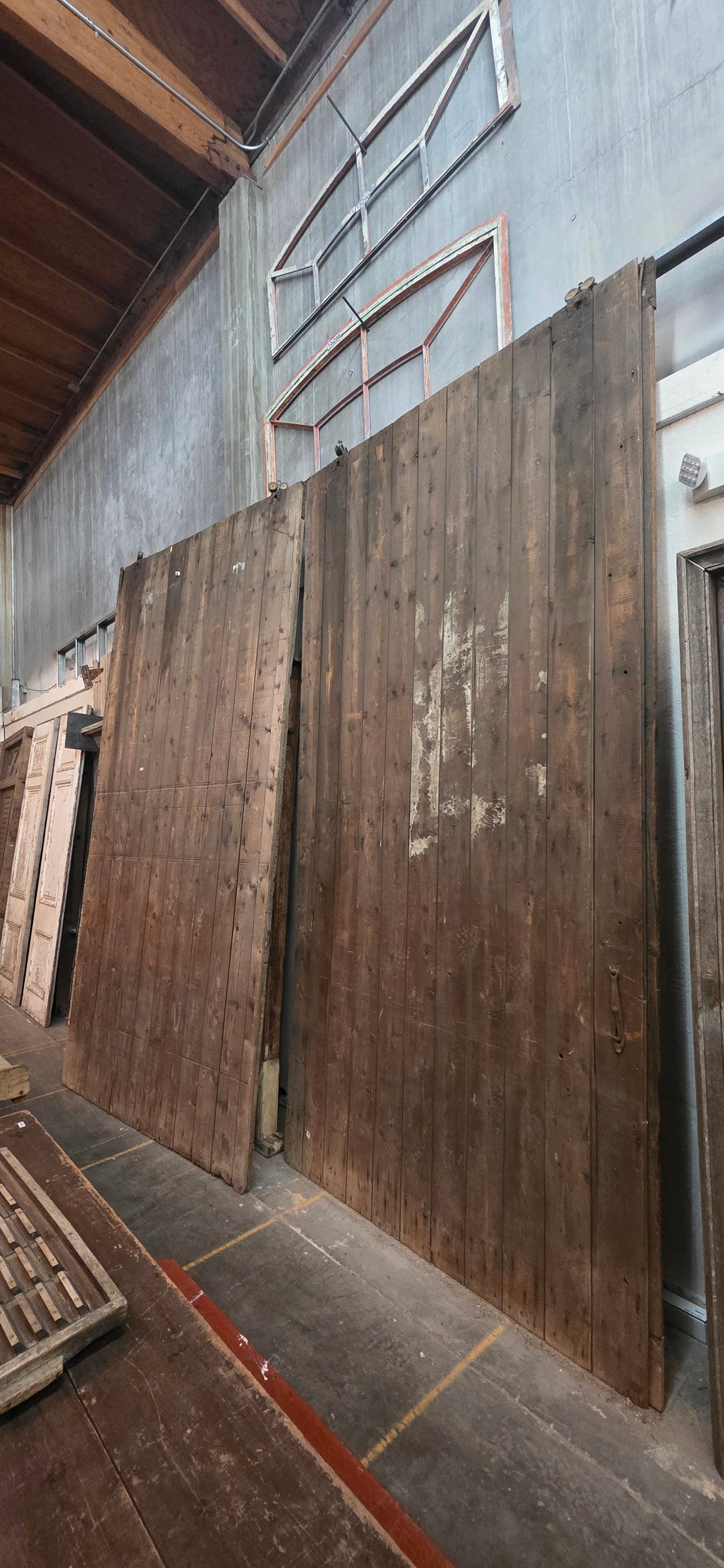 Pair of 11 Panel Natural Wood Barn Doors
