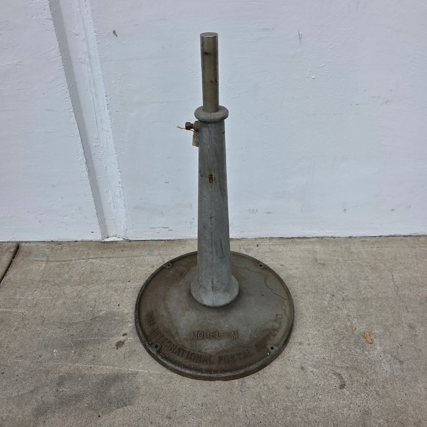 "The International Postal Supply Co." Stand (industrial salvage)