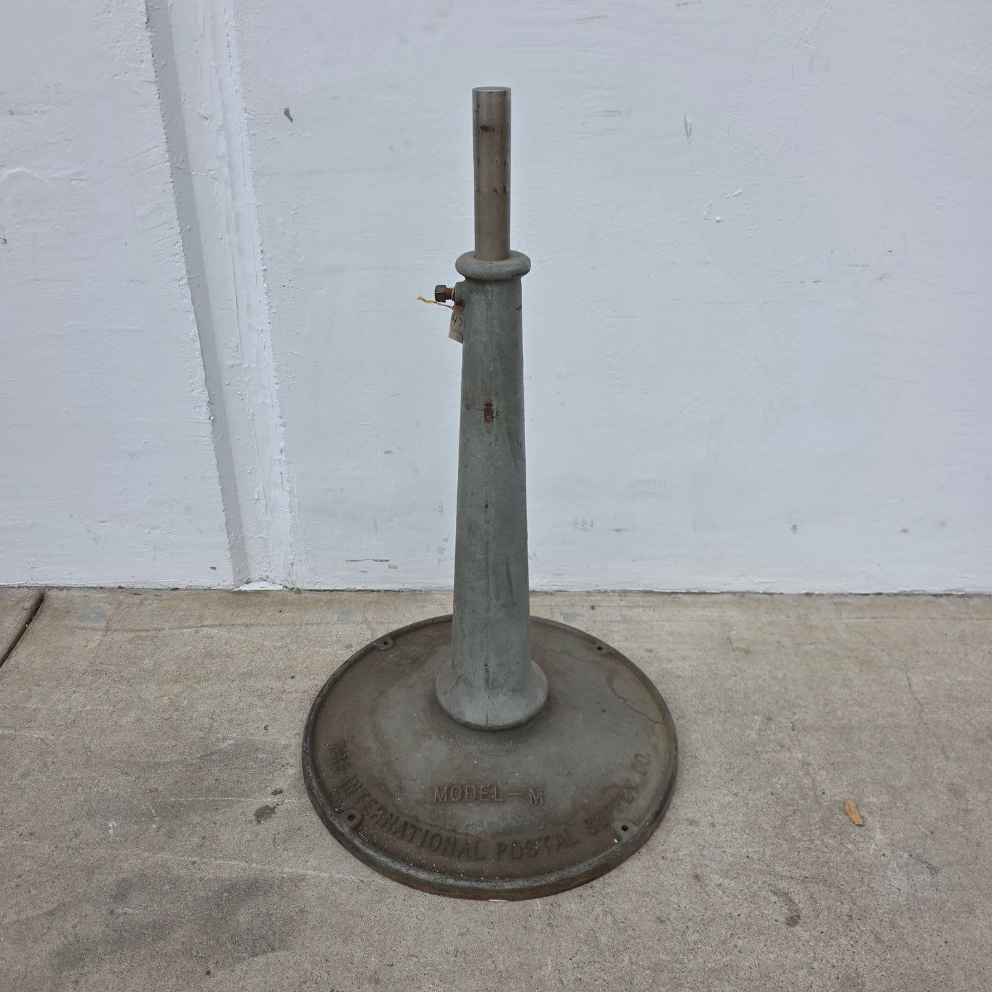 "The International Postal Supply Co." Stand (industrial salvage)