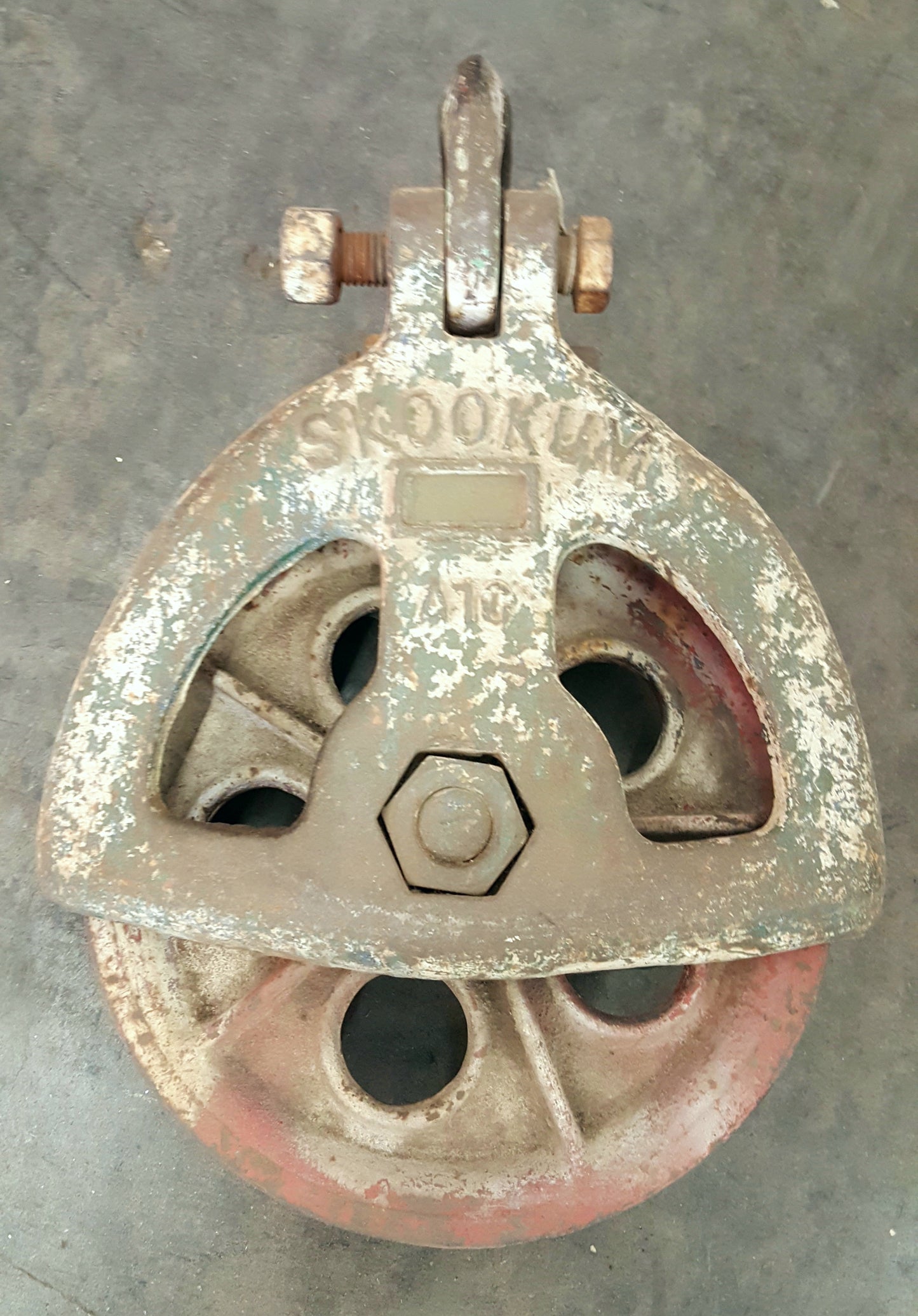Pulley, white paint, iron