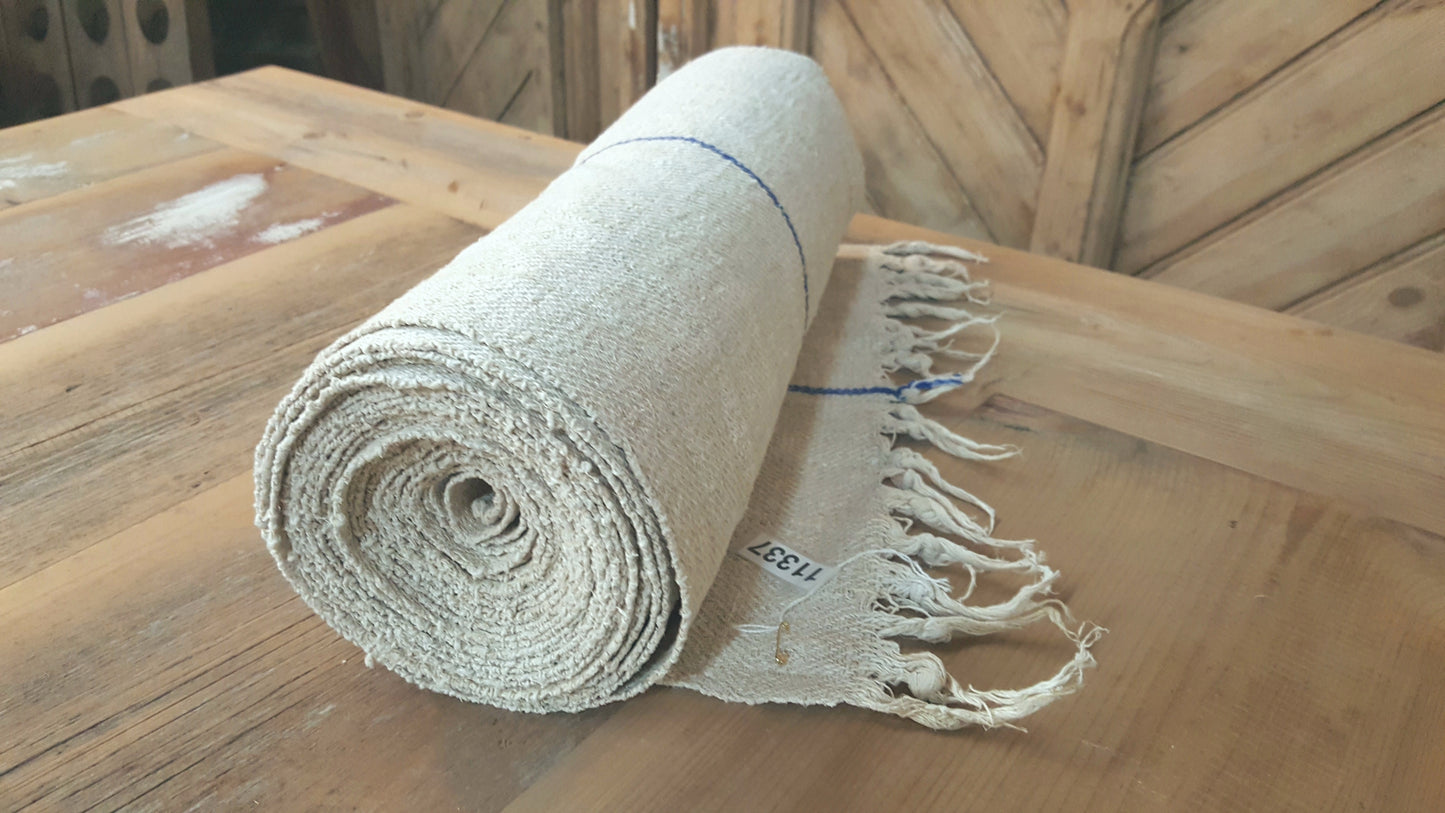 Roll of White Grain Sack Fabric with Blue Single Stripe