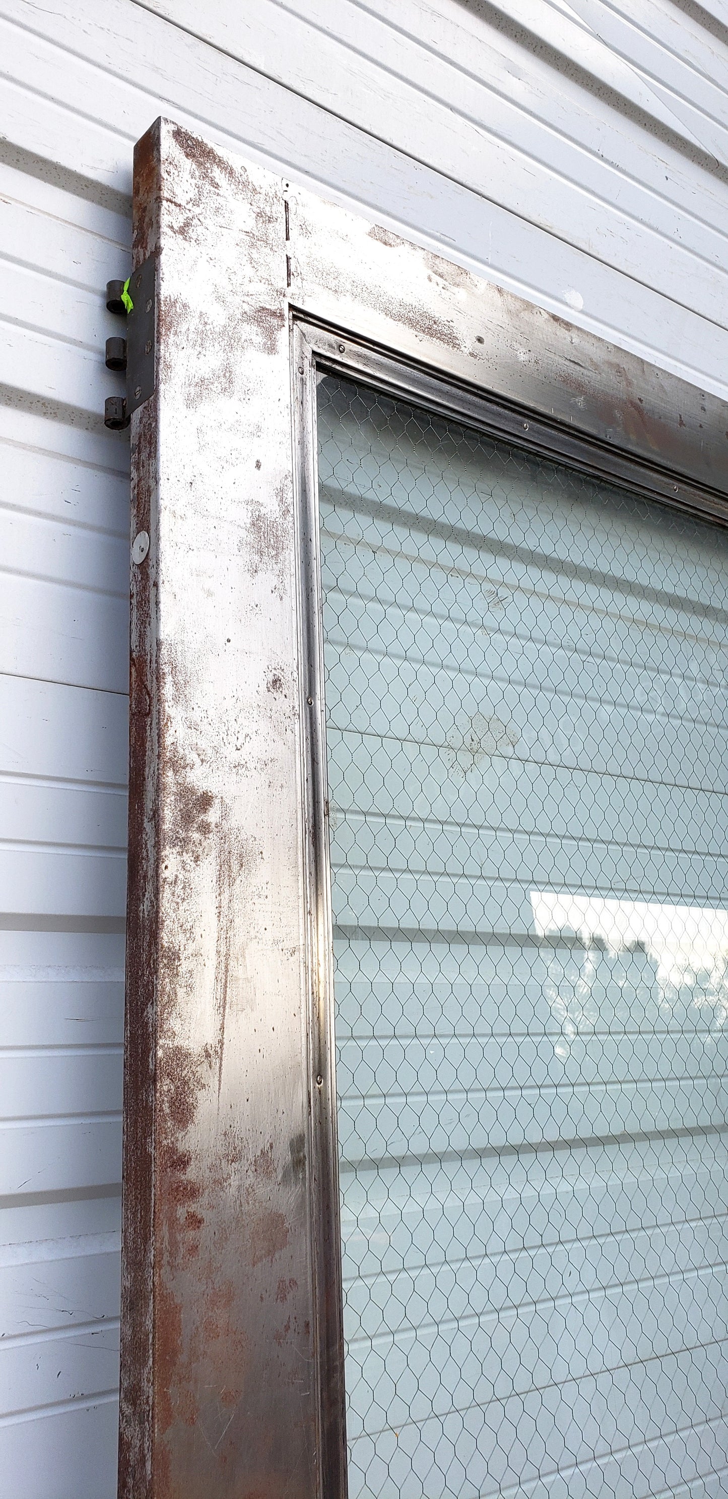Oversized Single Metal Door with Chicken Wire Glass