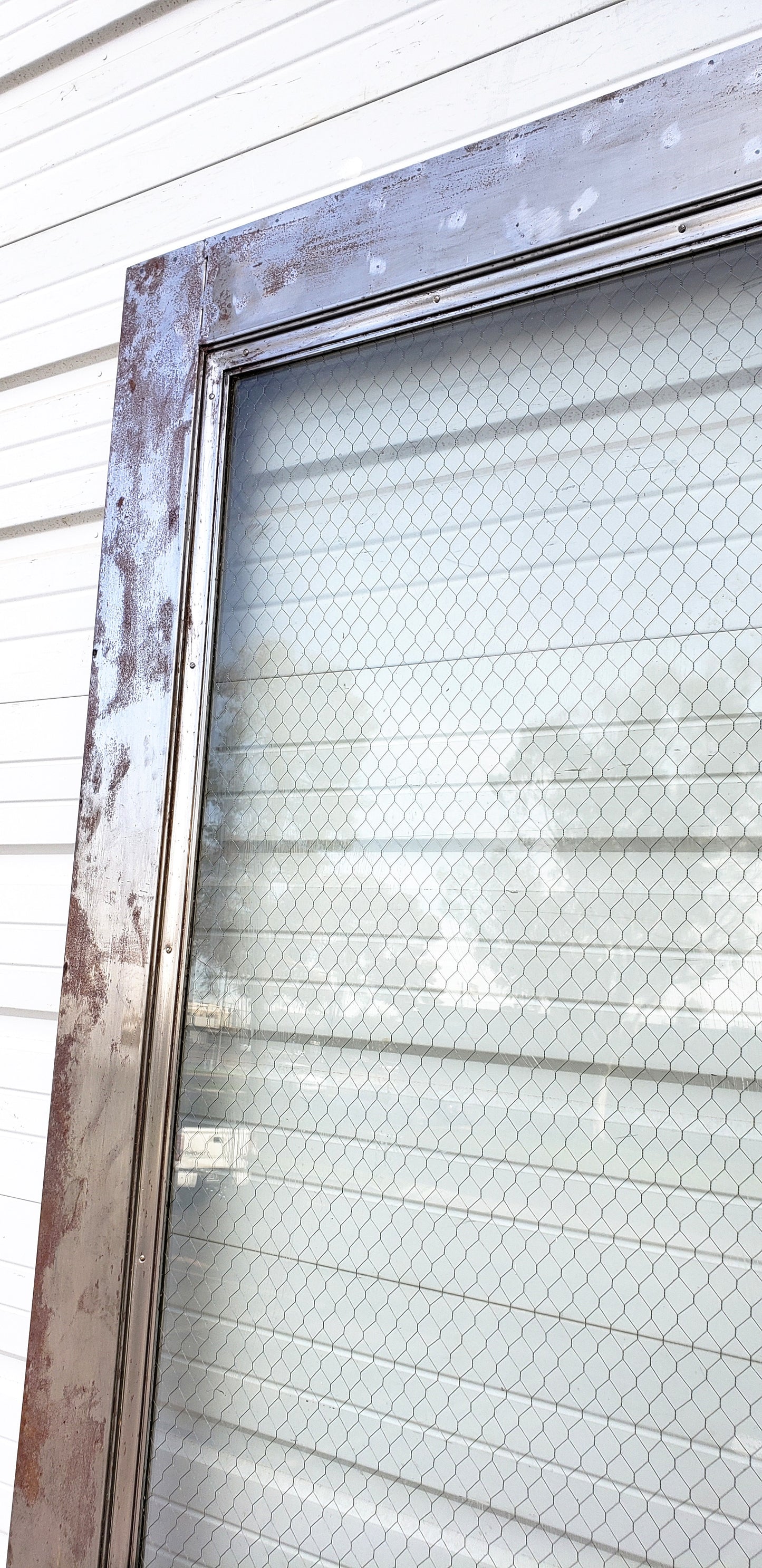 Oversized Single Metal Door with Chicken Wire Glass