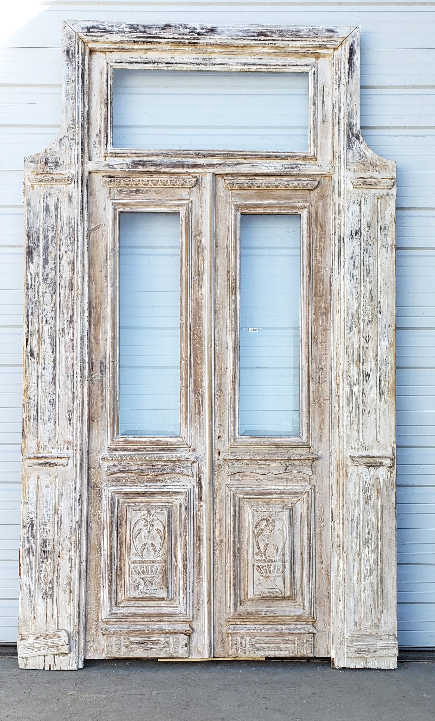 Pair of Washed Antique Wood Single Lite French Carved Doors