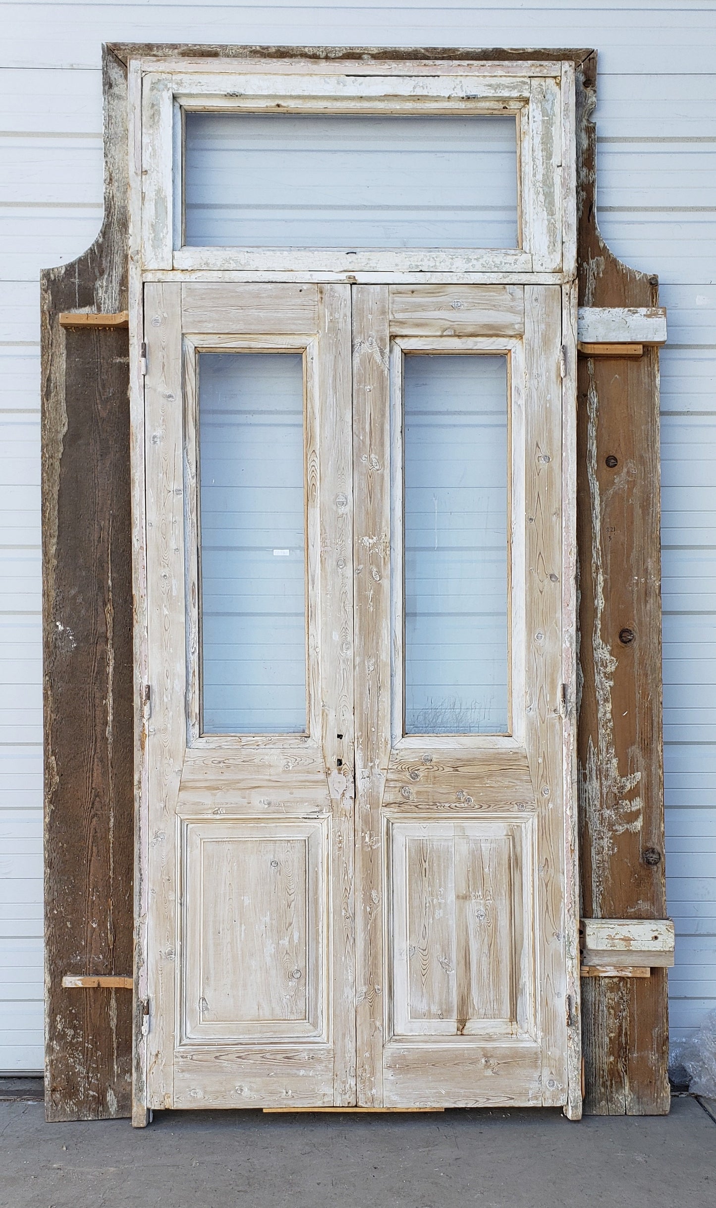 Pair of Washed Antique Wood Single Lite French Carved Doors