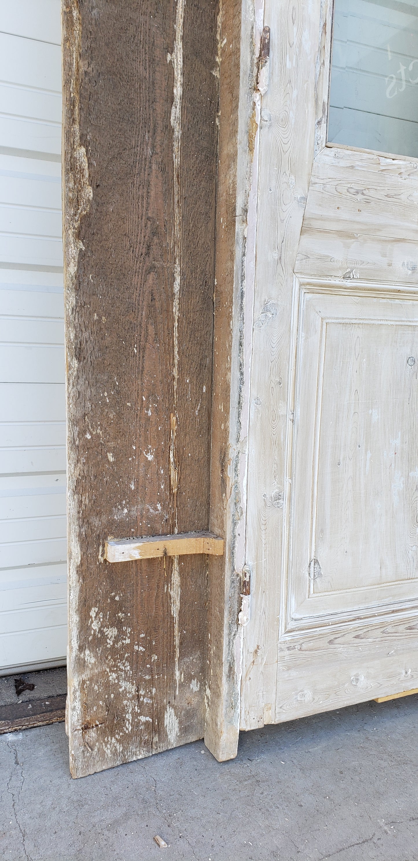 Pair of Washed Antique Wood Single Lite French Carved Doors with Transom Window