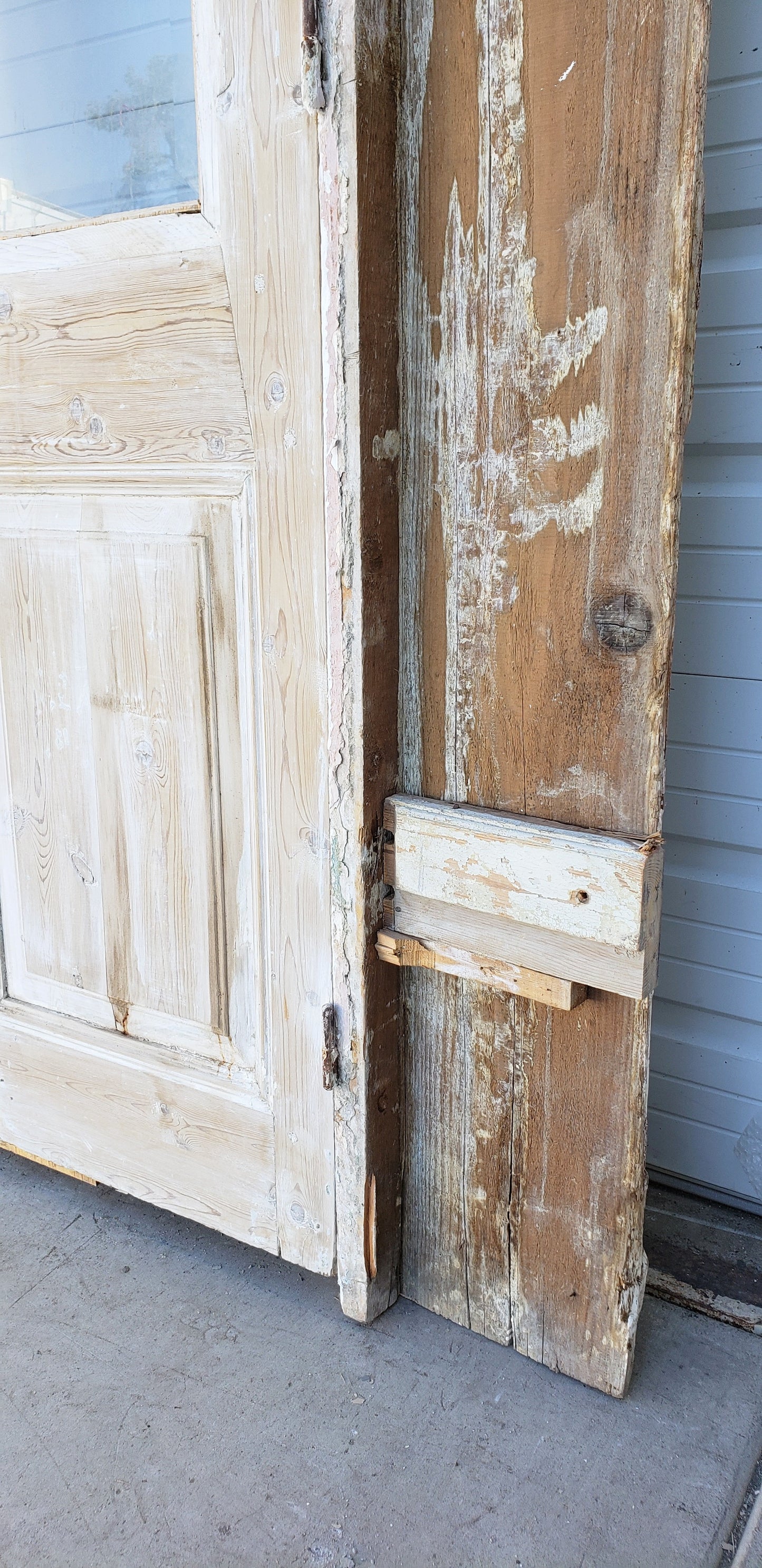 Pair of Washed Antique Wood Single Lite French Carved Doors with Transom Window