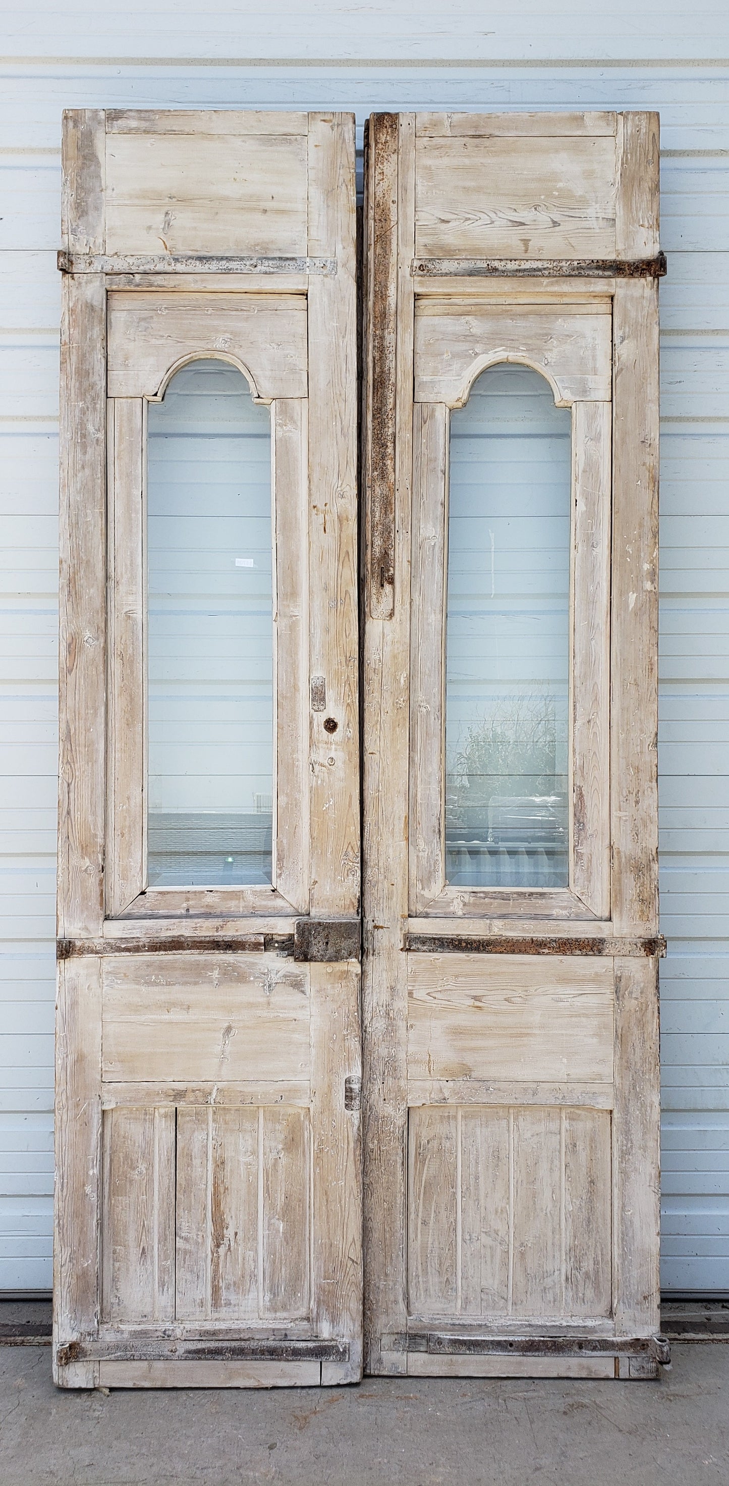 Pair of Single Lite Washed Antique Carved Doors