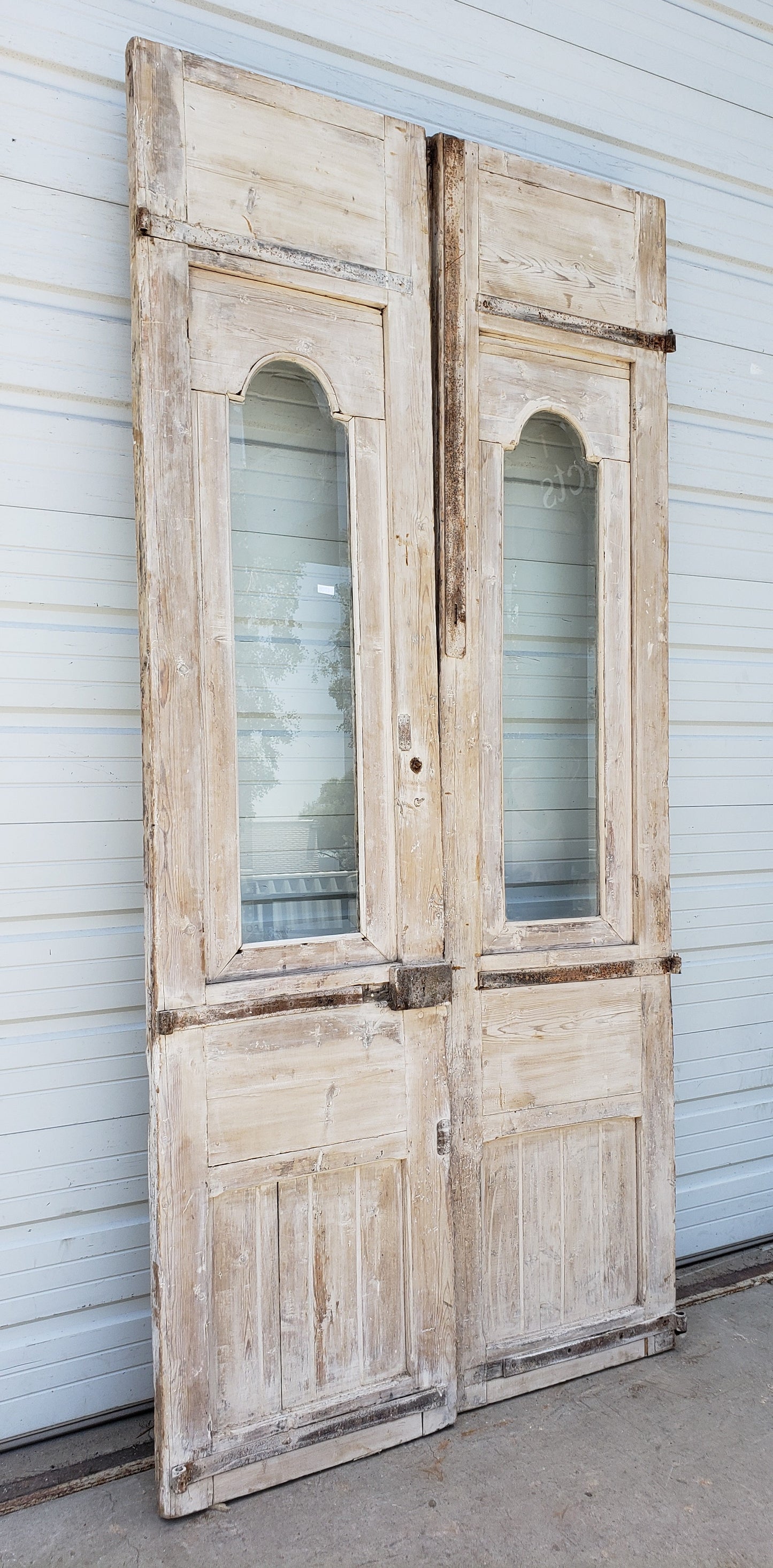 Pair of Single Lite Washed Antique Carved Doors