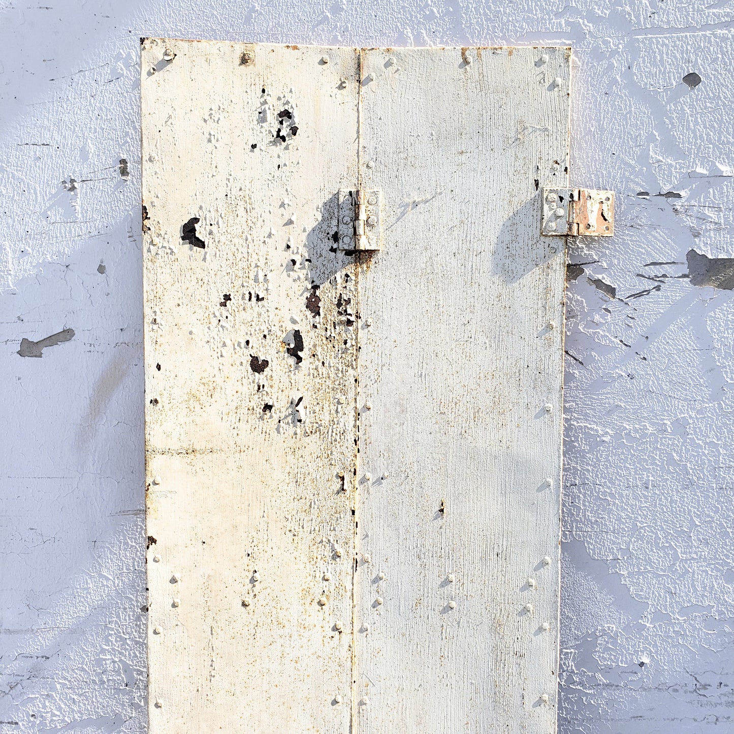 White Metal Bi-fold Shutter