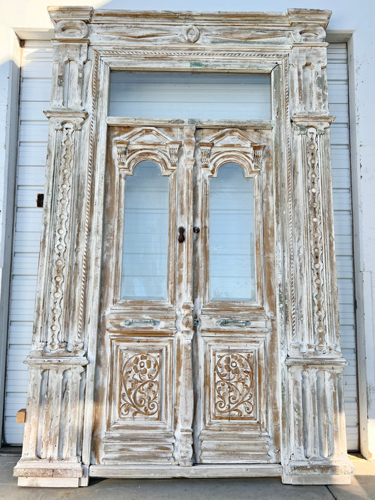 Pair of Ornately Carved Antique Doors in Large Frame with Transom