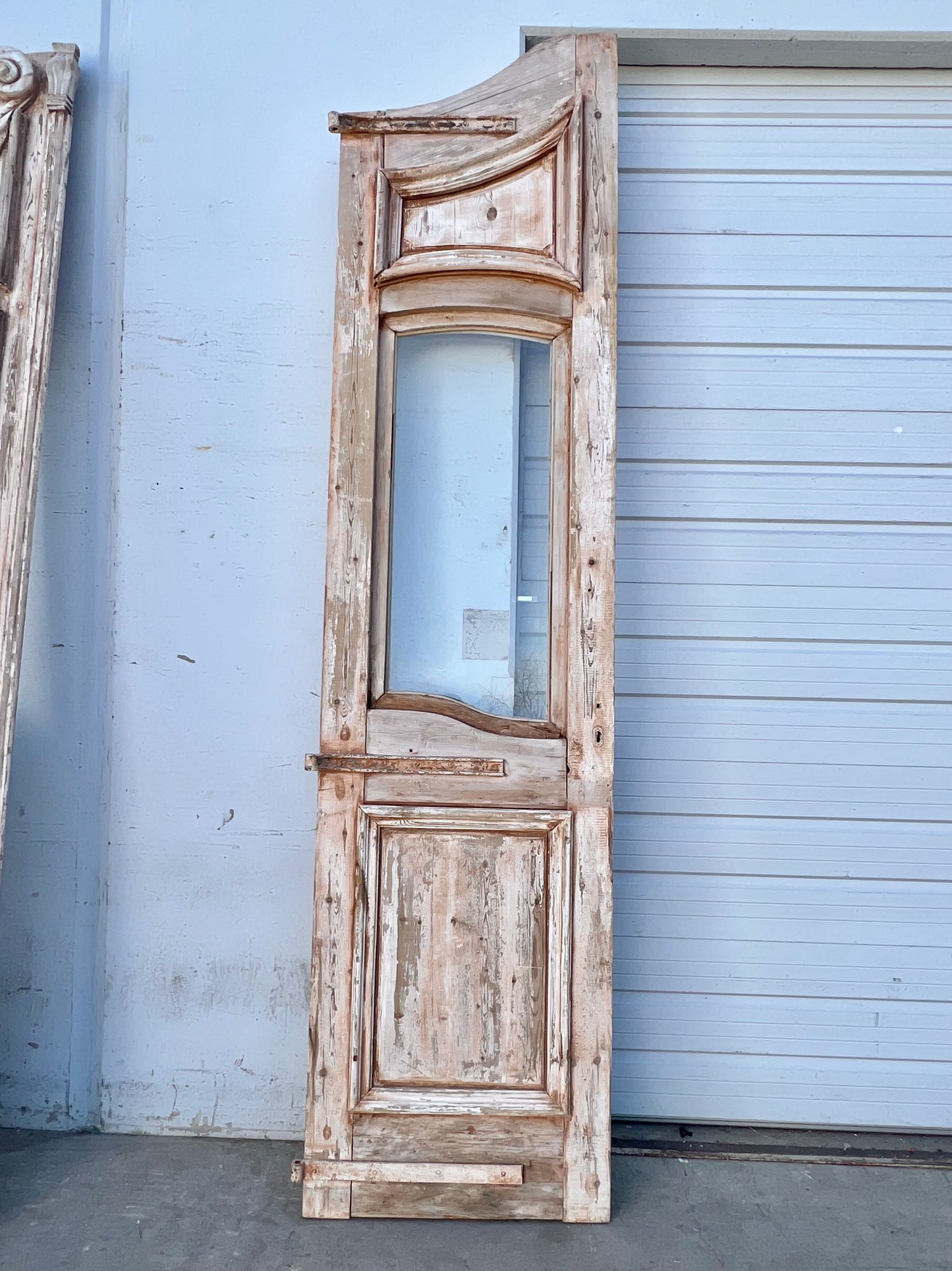 Pair of Washed Antique Wood Arched Single Lite Carved Doors with Raised Panels