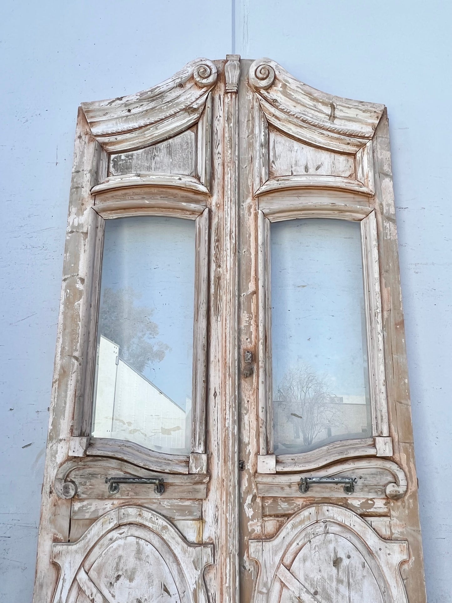 Pair of Washed Antique Wood Arched Single Lite Carved Doors with Raised Panels