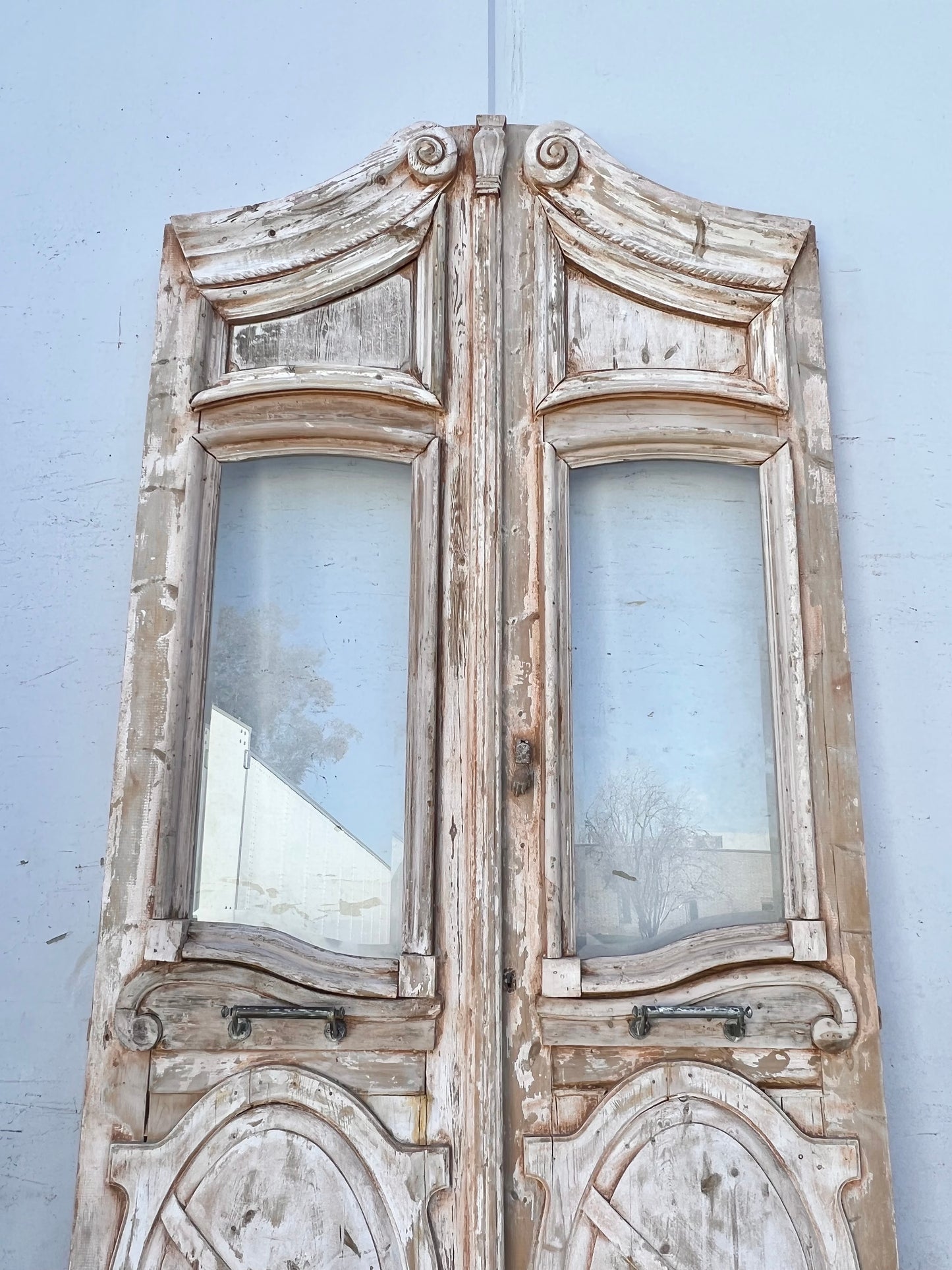 Pair of Washed Antique Wood Arched Single Lite Carved Doors with Raised Panels