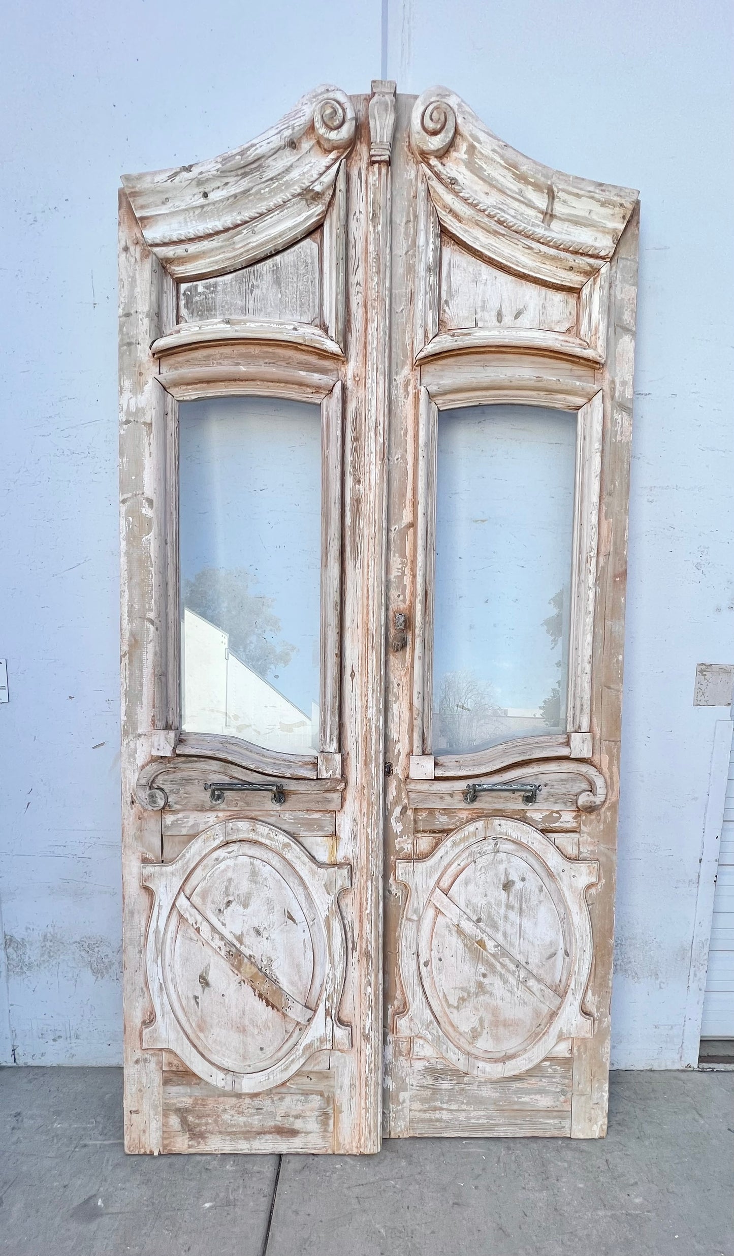 Pair of Washed Antique Wood Arched Single Lite Carved Doors with Raised Panels