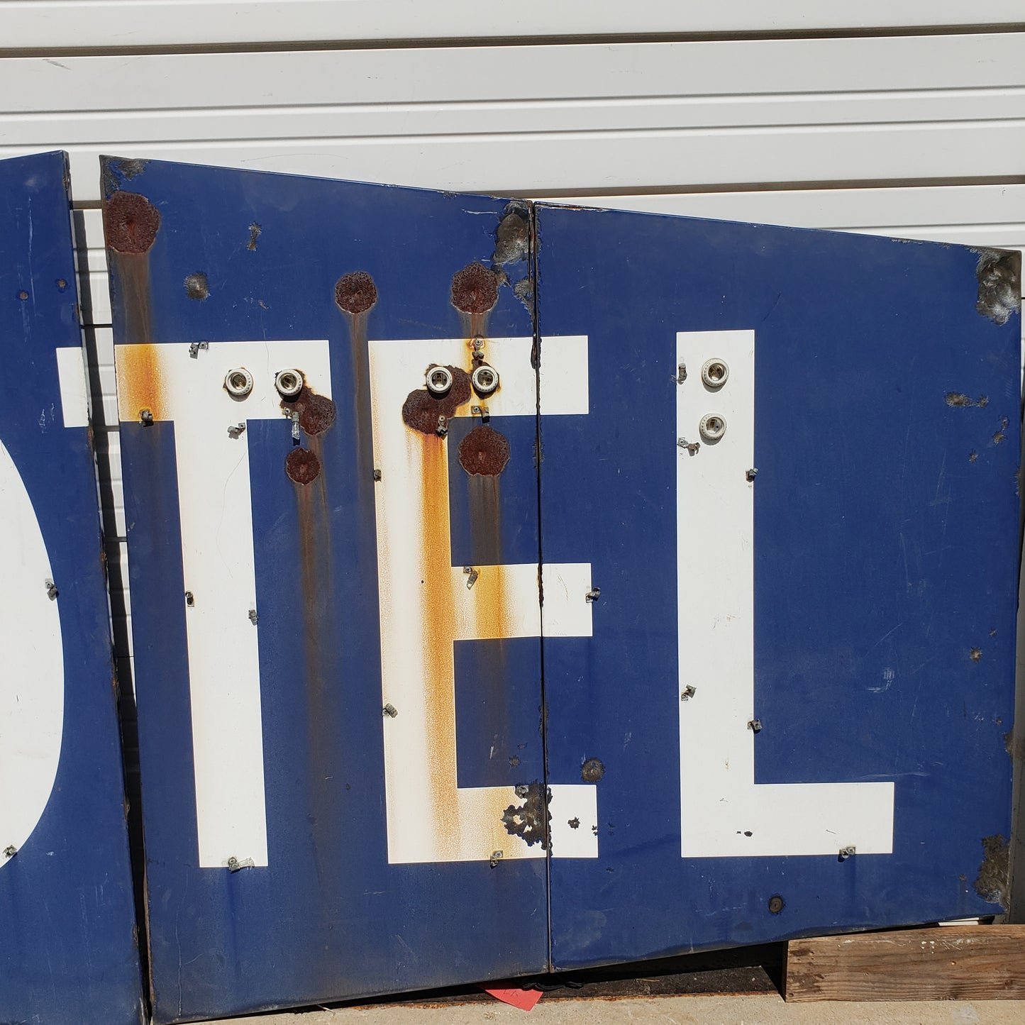 Blue and White “MOTEL" Sign