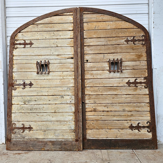 Pair of Arched Wood Doors w/Iron Trim