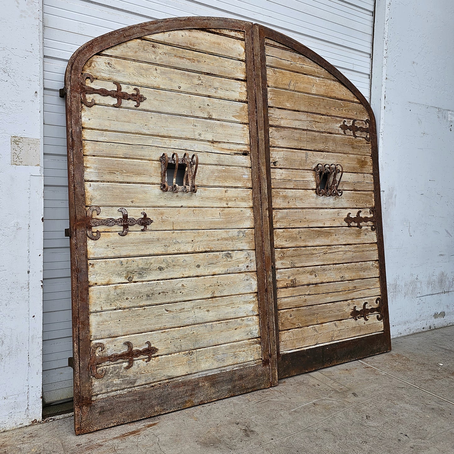 Pair of Arched Wood Doors w/Iron Trim