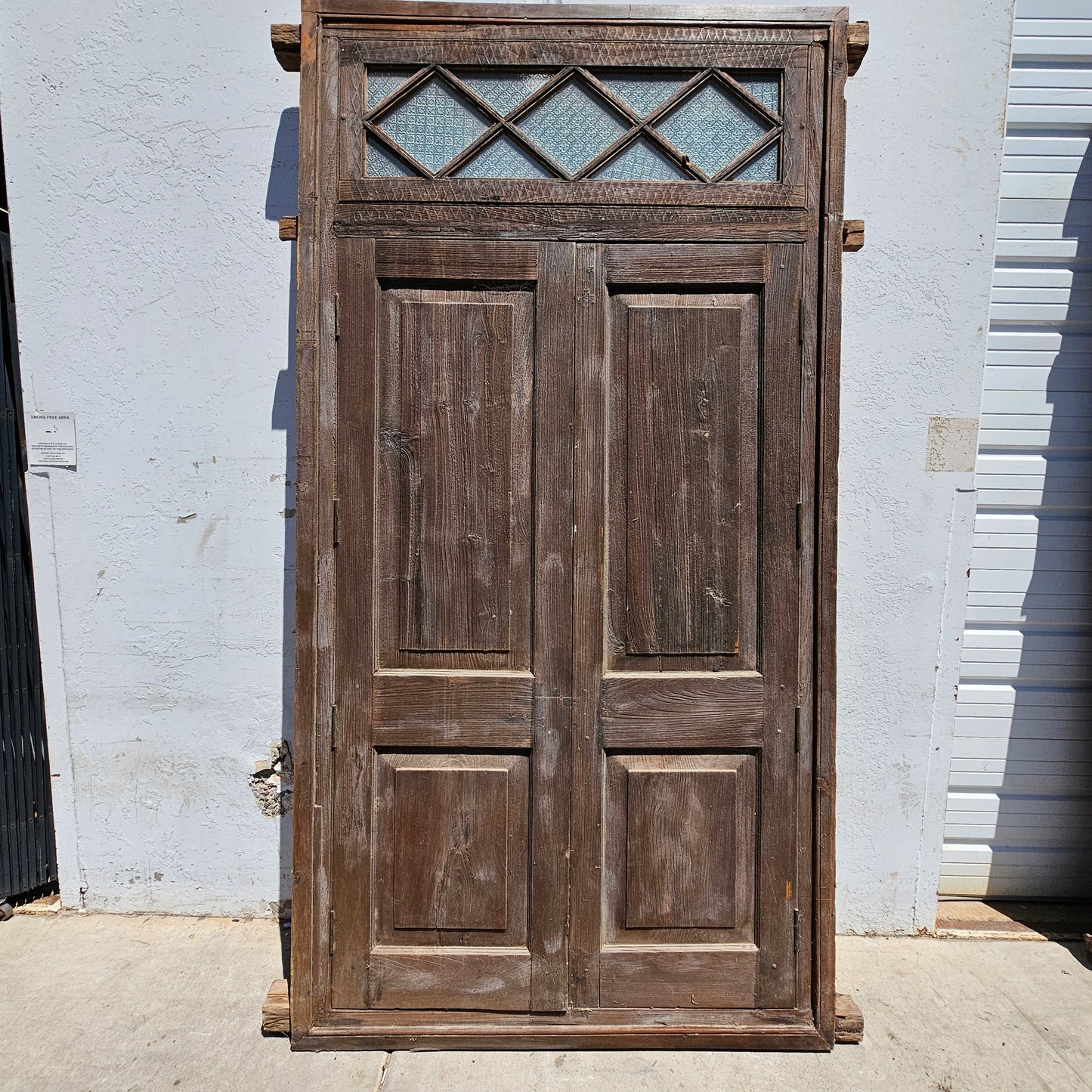 Pair of Wood Shuttered Doors with Glass Transom in Frame