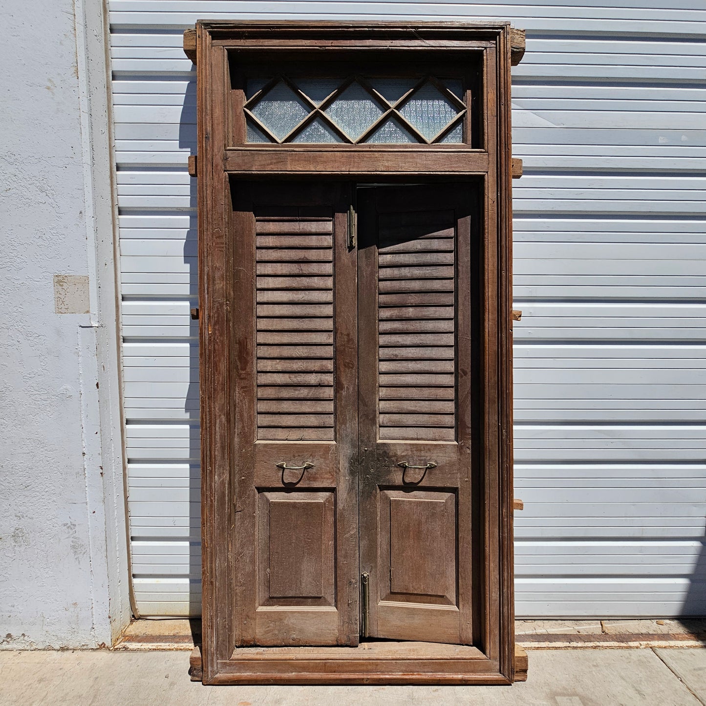 Pair of Wood Shuttered Doors with Glass Transom in Frame