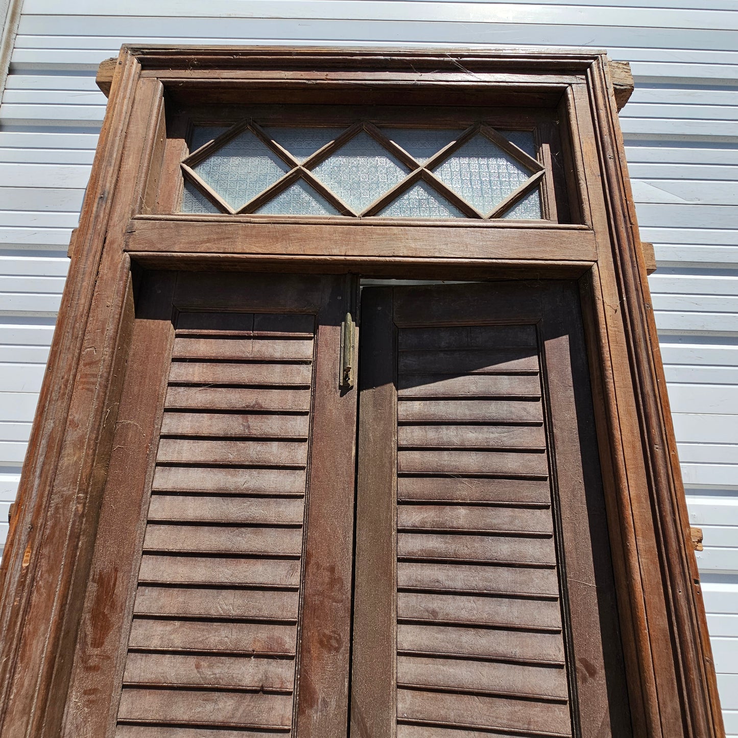 Pair of Wood Shuttered Doors with Glass Transom in Frame