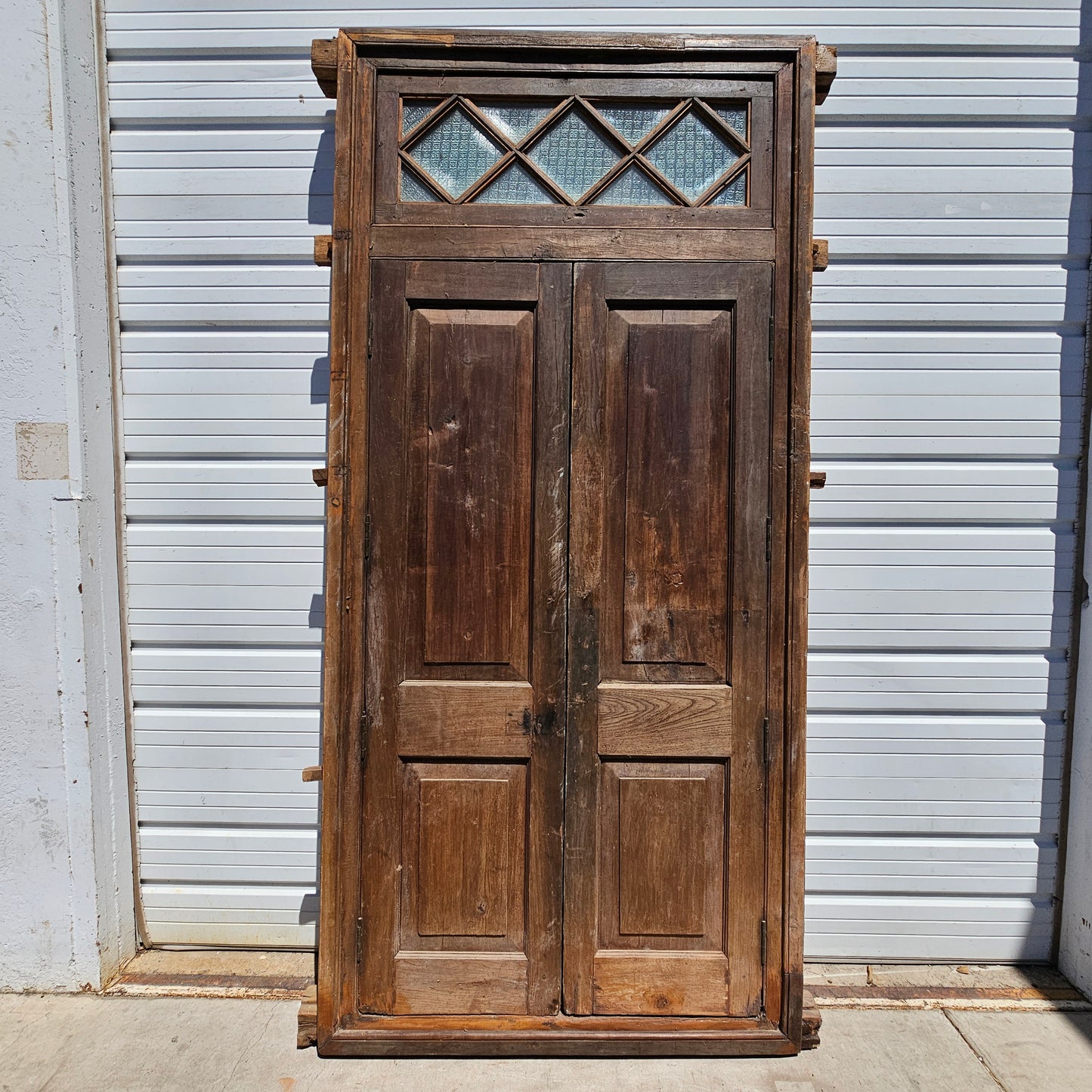 Pair of Wood Shuttered Doors with Glass Transom in Frame