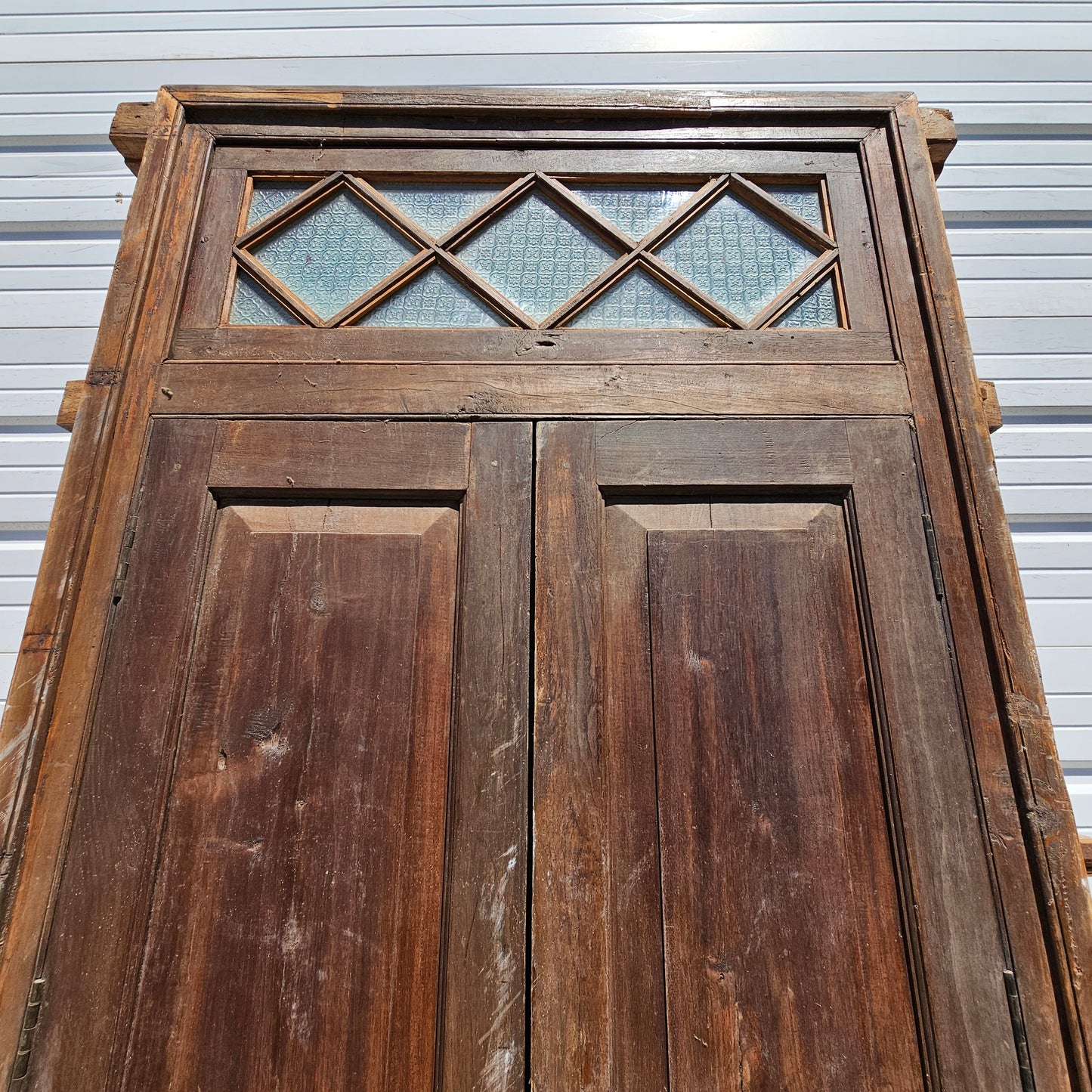 Pair of Wood Shuttered Doors with Glass Transom in Frame