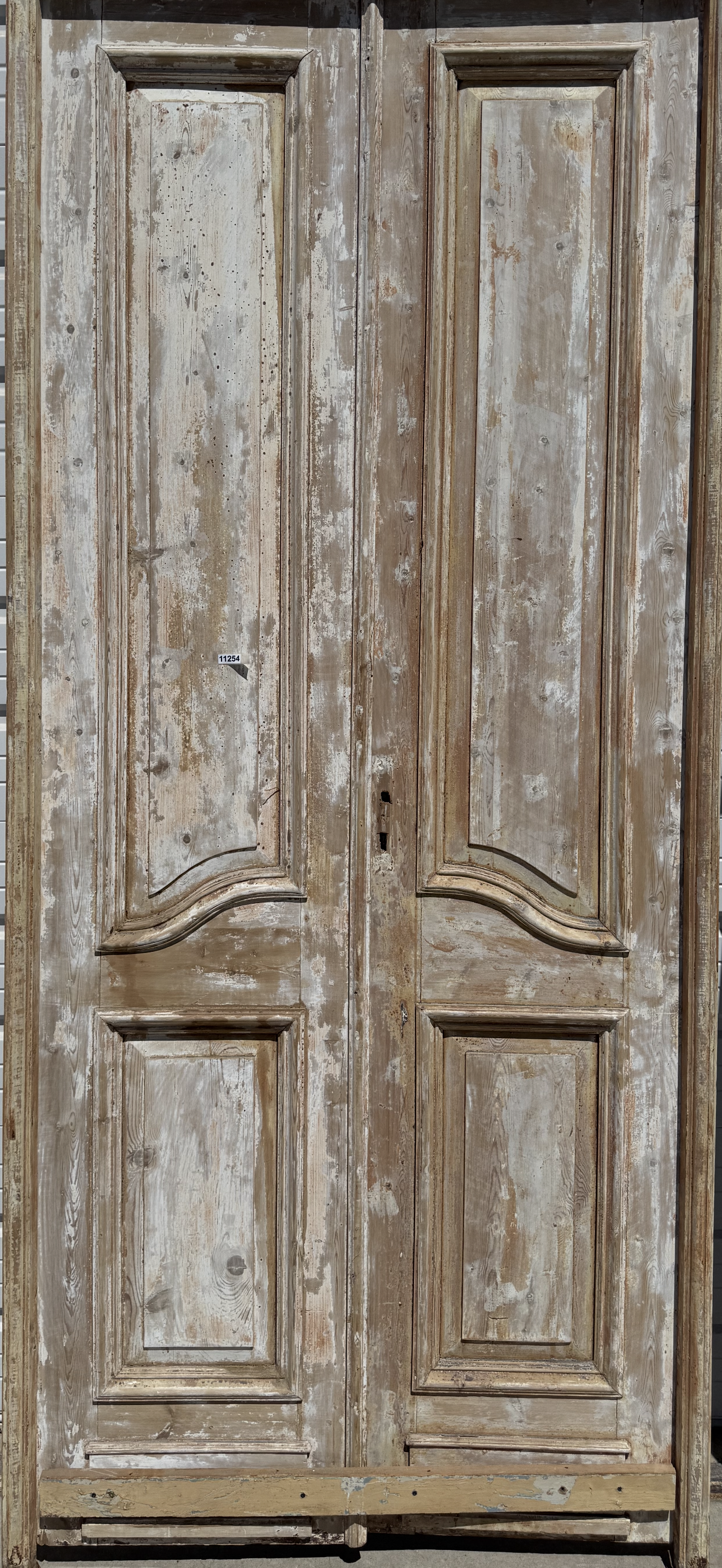 Pair of Framed 3 Panel Distressed Antique Doors with Circle Transom