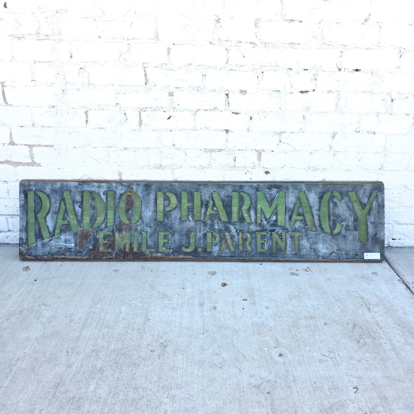Radio Pharmacy Metal Sign on Wood