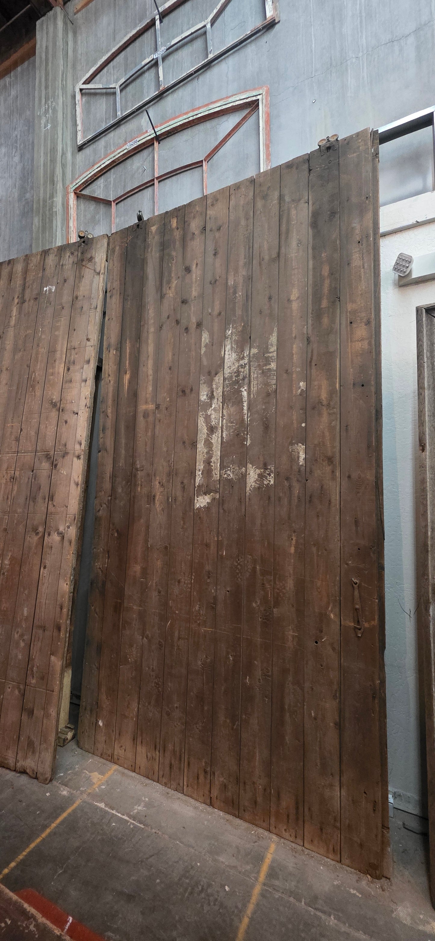 Pair of 11 Panel Natural Wood Barn Doors