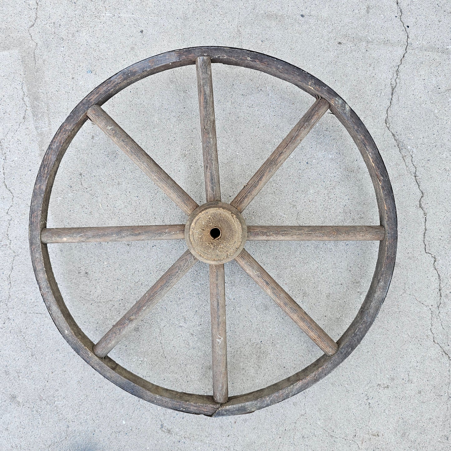 Display Stack of Antique Wooden Cart Wheels