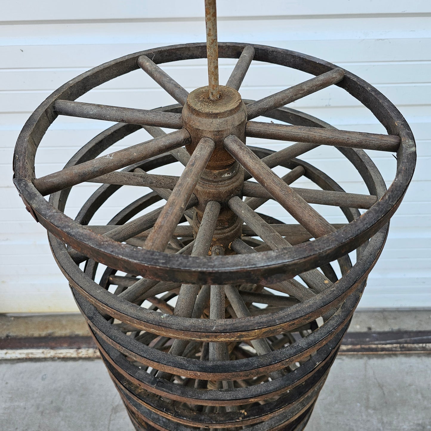 Display Stack of Antique Wooden Cart Wheels