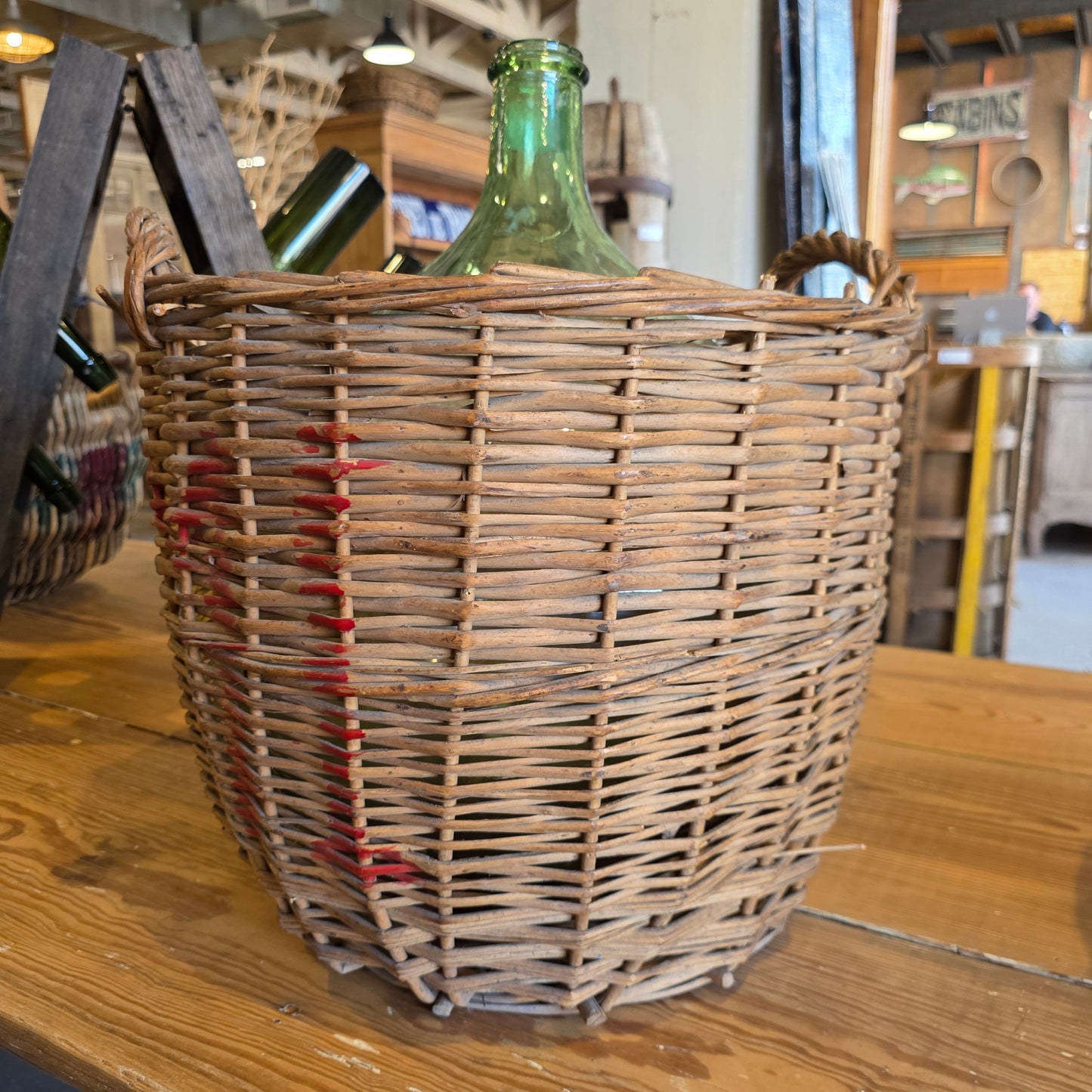 Clear Glass Demijohn Wine Bottle in Wicker Basket