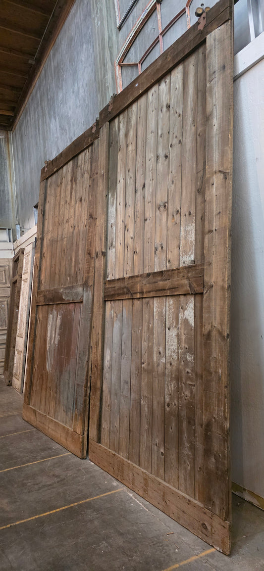 Pair of 11 Panel Natural Wood Barn Doors
