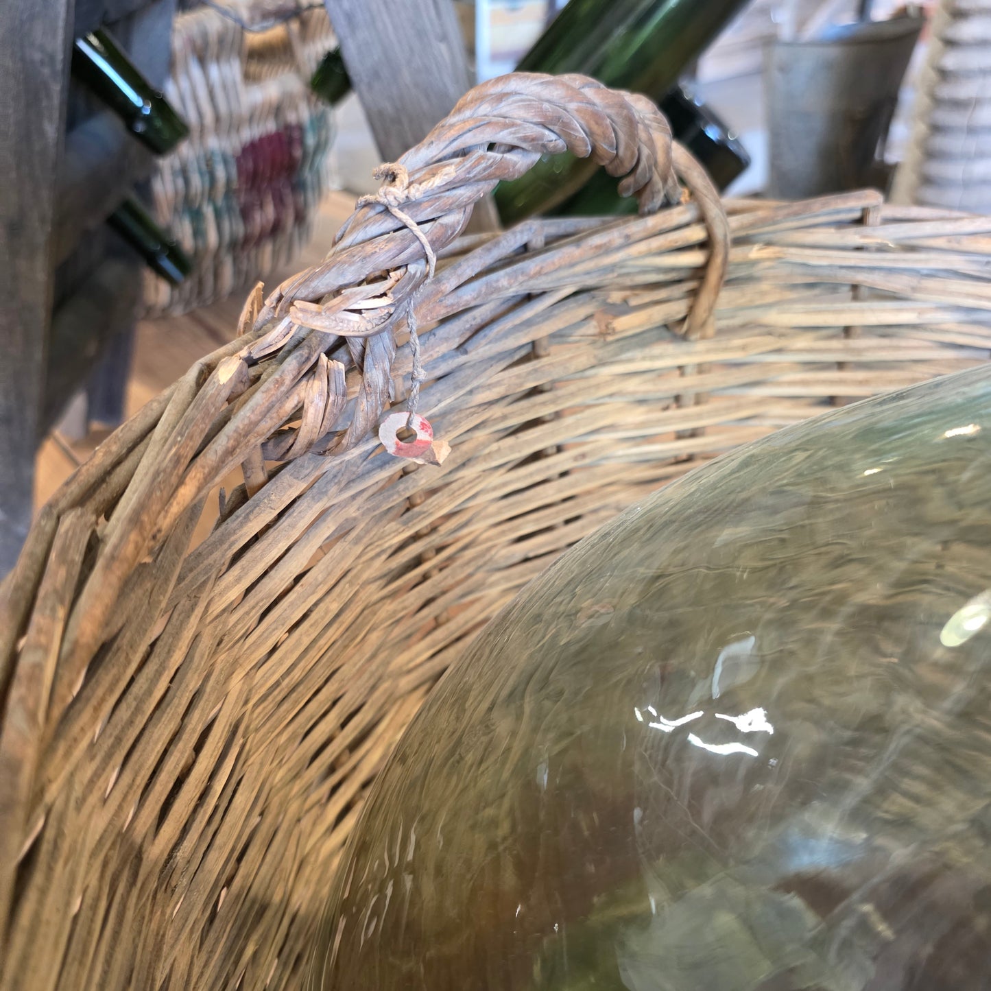 Clear Glass Demijohn Wine Bottle in Wicker Basket