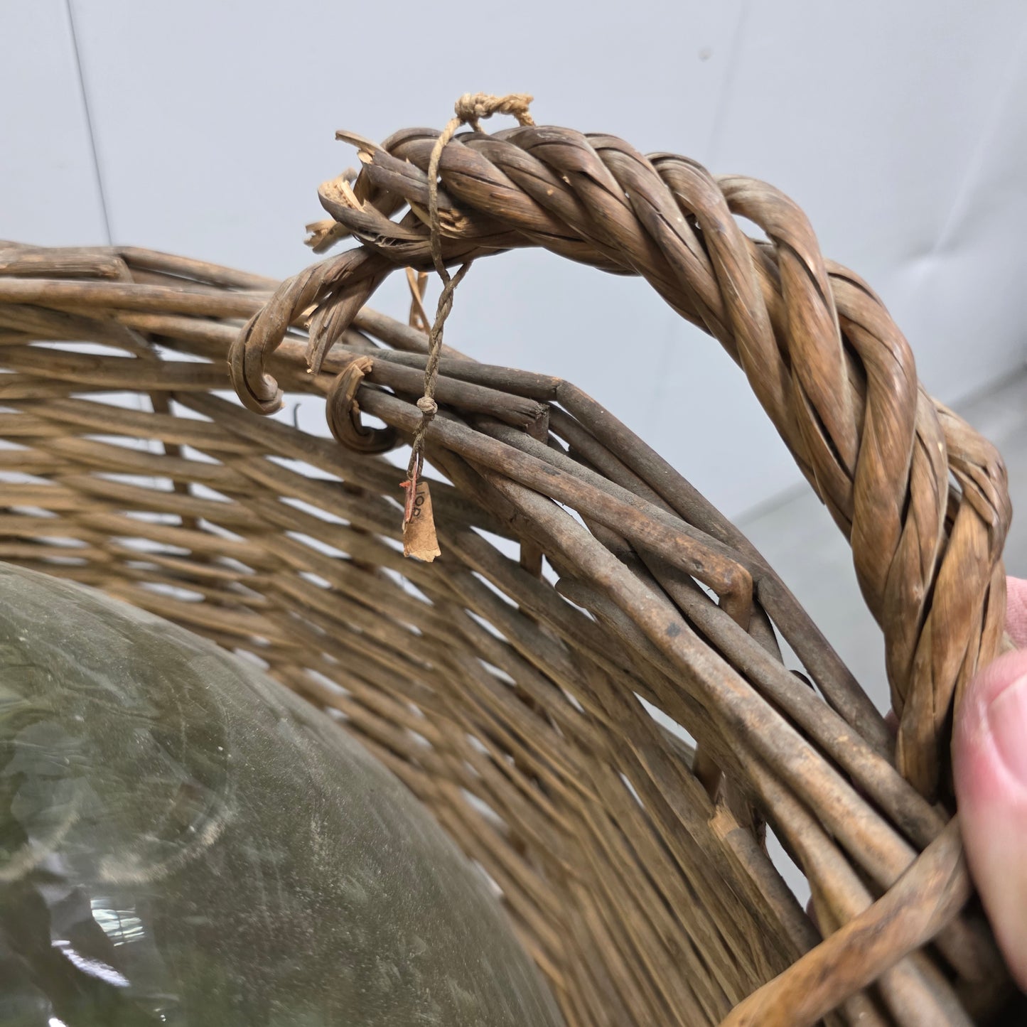 Clear Glass Demijohn Wine Bottle in Wicker Basket