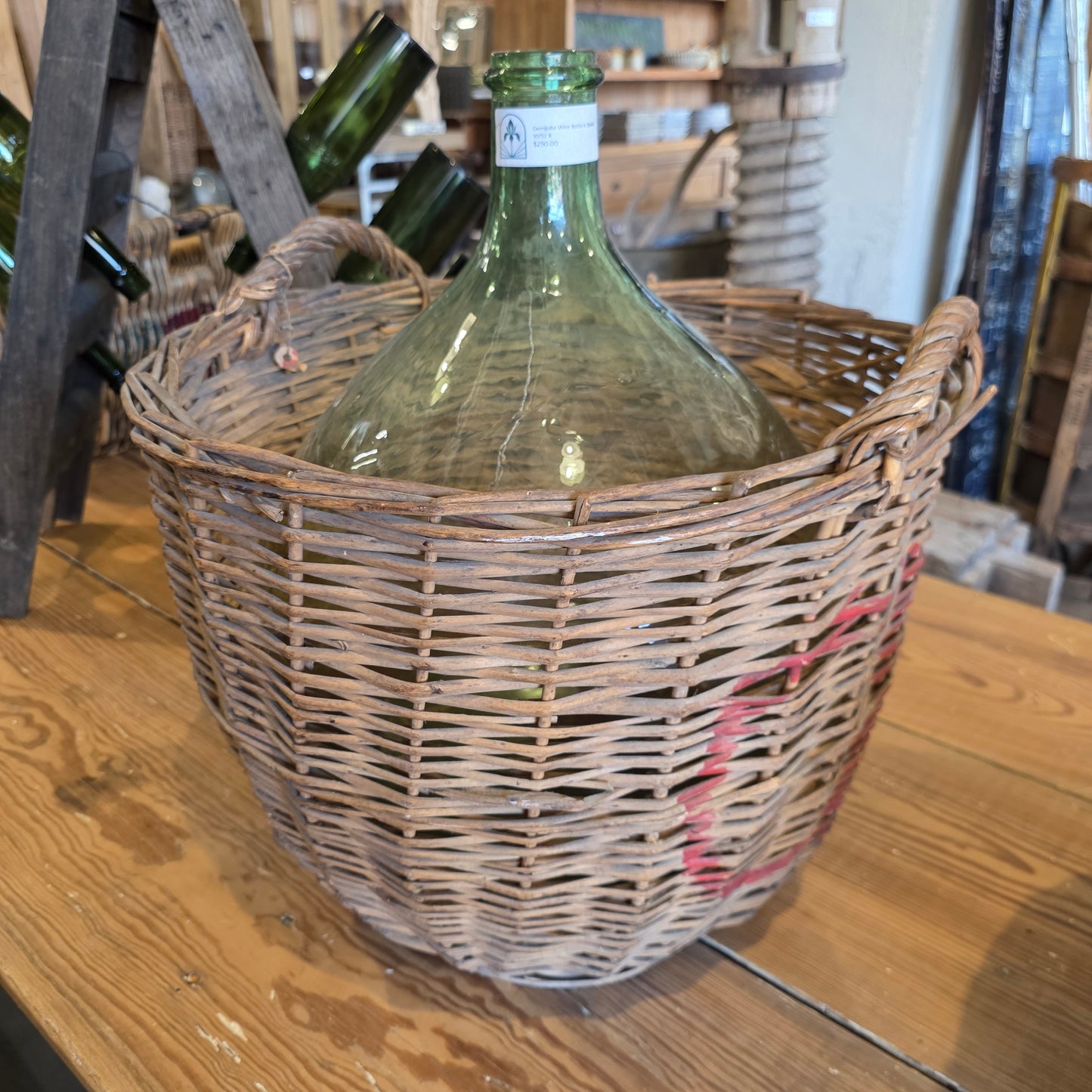 Clear Glass Demijohn Wine Bottle in Wicker Basket