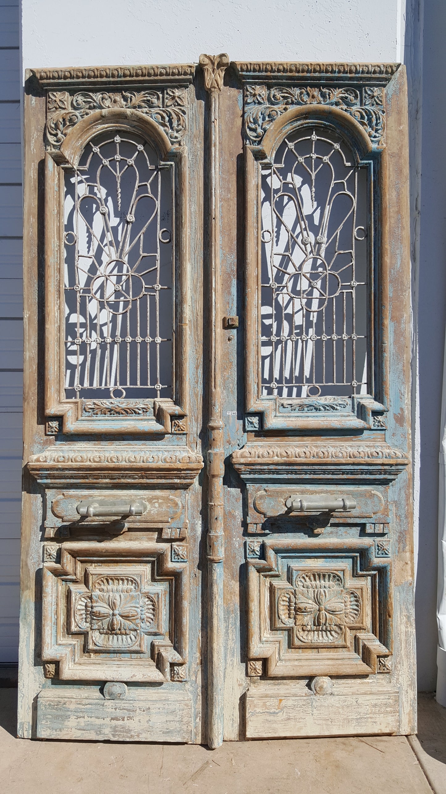 Pair of Ornate Wood Carved Antique Doors with Iron Inserts (no glass)