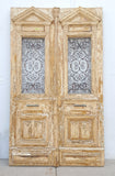 Pair of Antique Ornate Wood Carved Doors with Iron Scrollwork Inserts