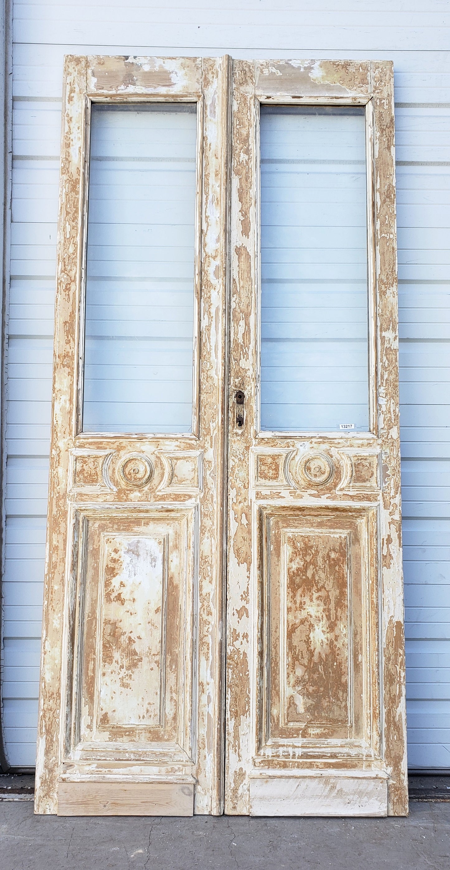 Pair of Washed Wood Single Lite Carved Antique Doors