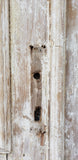 Pair of Framed 3 Panel Distressed Antique Doors with Circle Transom