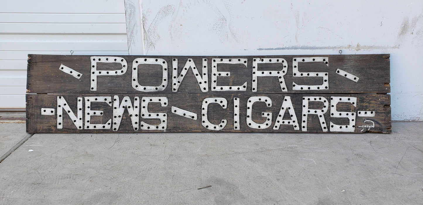 Powers News / Cigars Sign