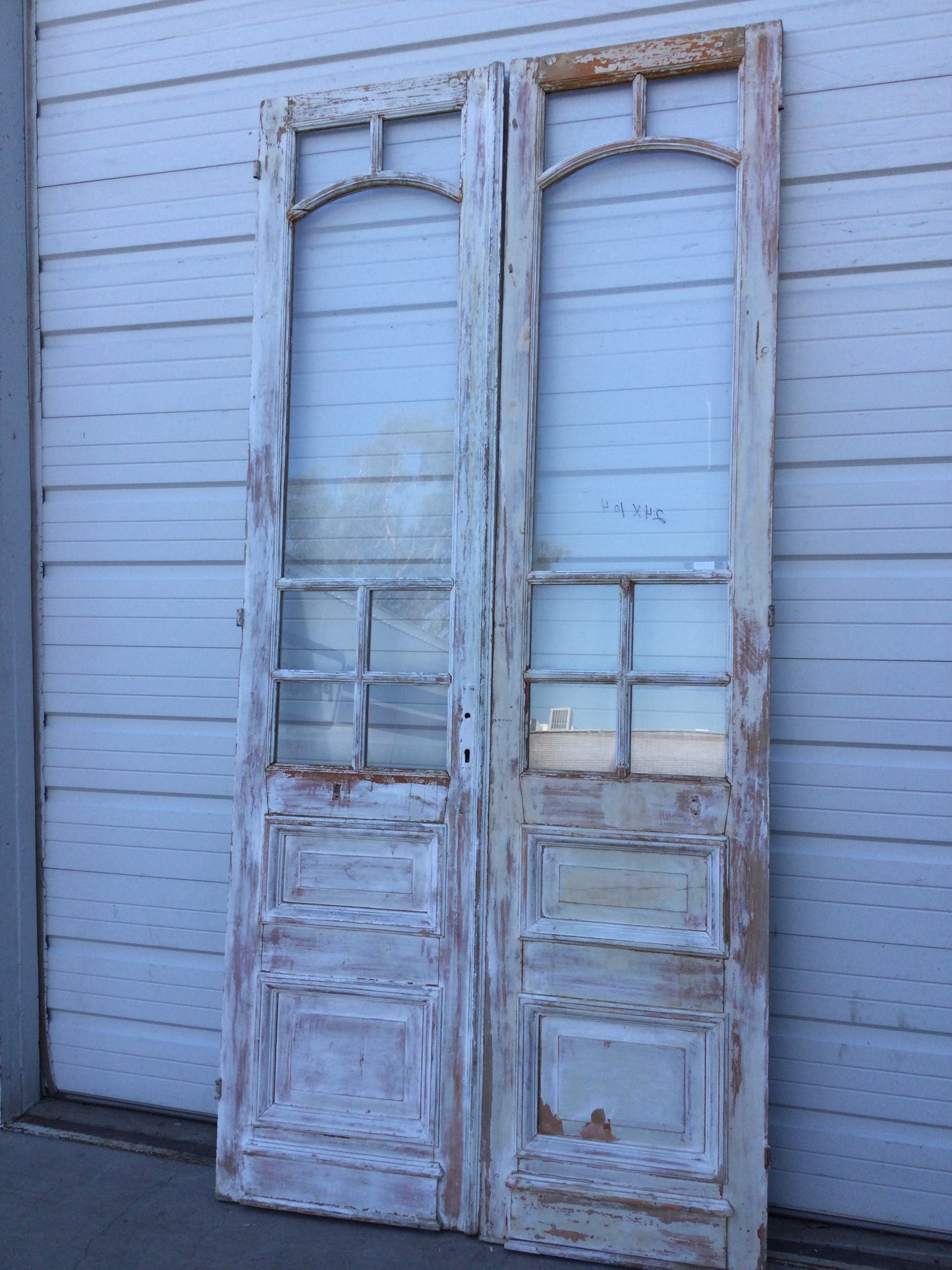 Pair of 2 Panel 7 Lite Washed Wood French Antique Doors